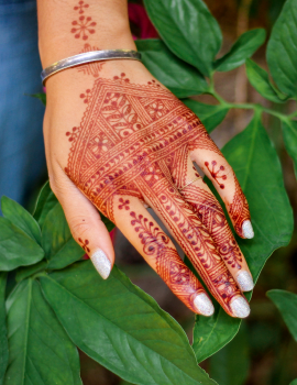 Henna hand covered in ochre henna